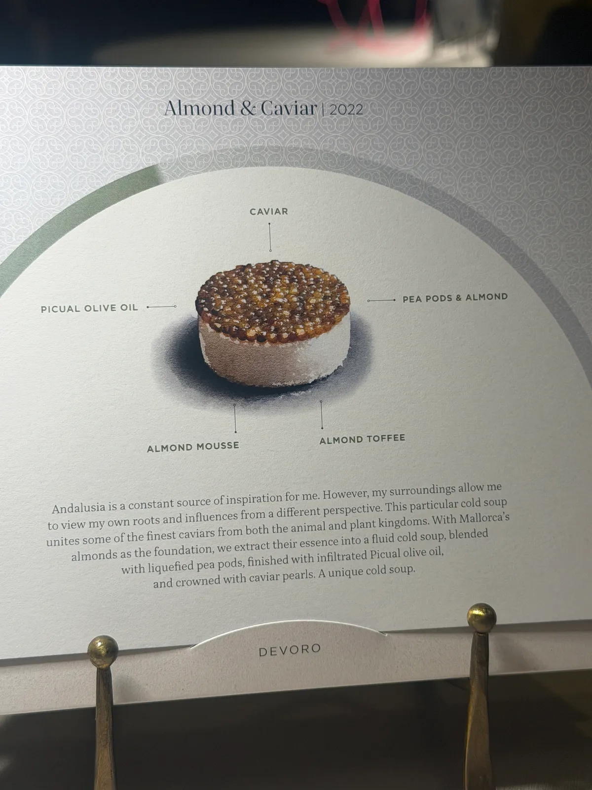 The illustrated 'Almond & Caviar' course card at VORO